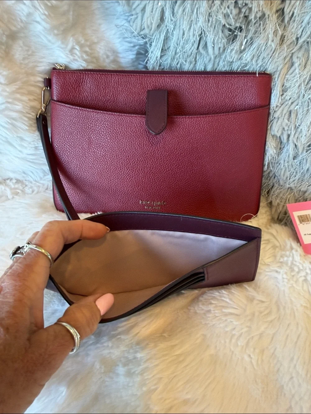 kate spade Burgundy Pebbled Leather Wristlet Clutch with Gold Tone Logo